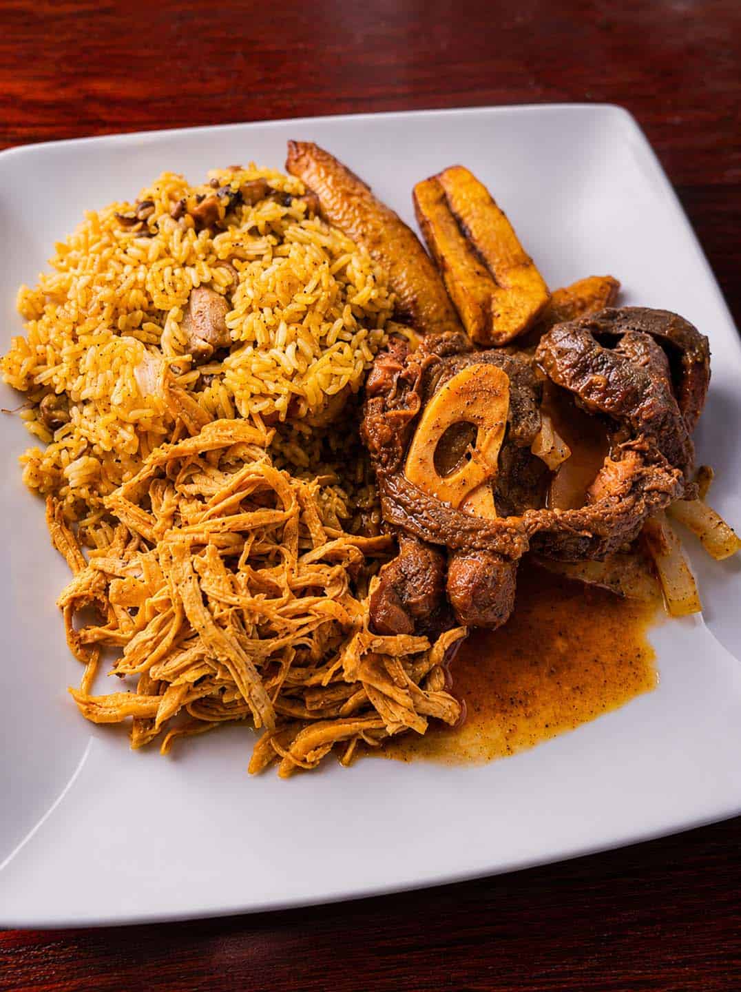 Dominican lunch with yellow rice, shredded chicken and stewed beef