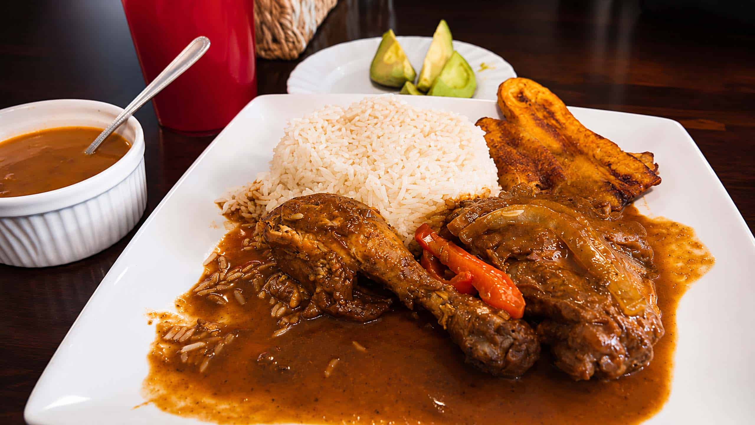 Dominican sancocho stew served with white rice